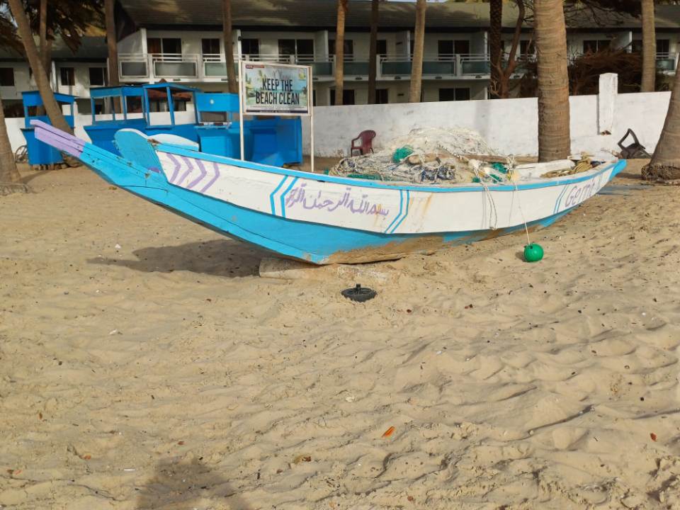 Colorful boat on sandy beach